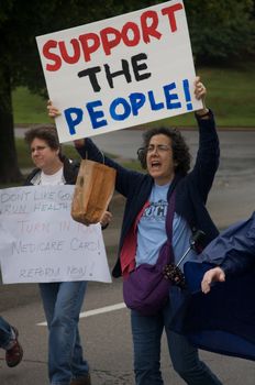 OKLAHOMA CITY, OK - SEPTEMBER 13, 2009: Protesters march to the Oklahoma capitol building to demonstrate their support for health care reform on September 13, 2009 in Oklahoma City, Oklahoma.