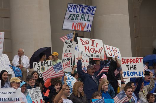 OKLAHOMA CITY, OK - SEPTEMBER 13, 2009: Protesters march to the Oklahoma capitol building to demonstrate their support for health care reform on September 13, 2009 in Oklahoma City, Oklahoma.