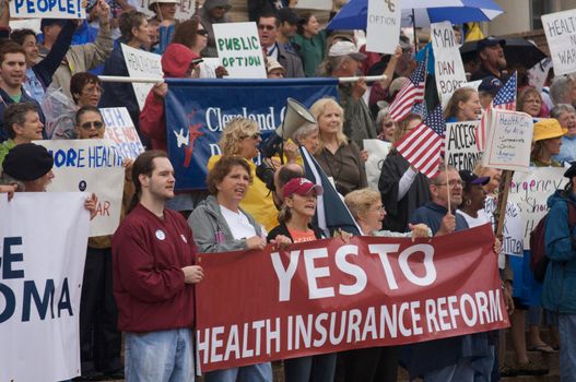 OKLAHOMA CITY, OK - SEPTEMBER 13, 2009: Protesters march to the Oklahoma capitol building to demonstrate their support for health care reform on September 13, 2009 in Oklahoma City, Oklahoma.