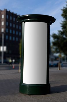 Blank outdoor advertising column with place for add copy samples. Clipping path included.