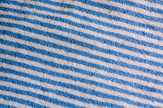 A blue and white striped beach towel material