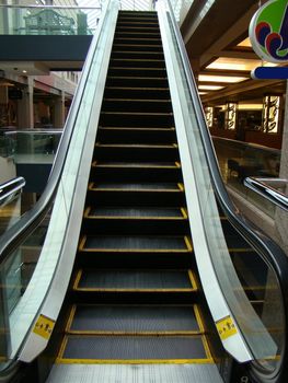 Escalator moving up to second level of shopping mall
