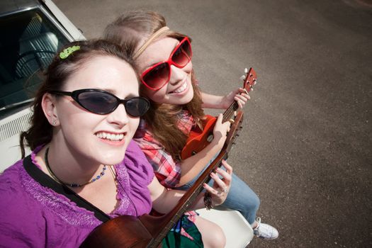 Female Musicians on an Old Car