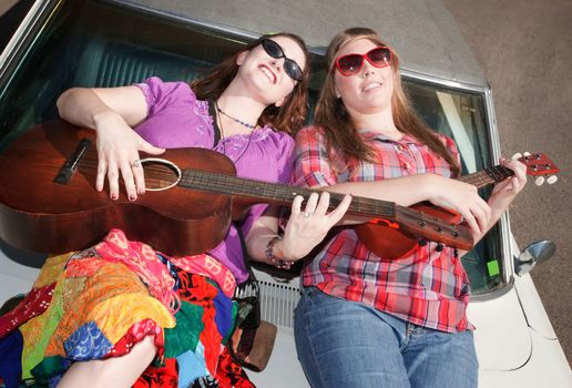 Female Musicians on an Old Car