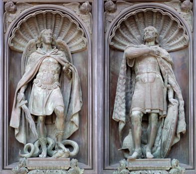 Bas-reliefs of archangel Michael and Alexander Nevsky on the door of Cathedral in st. Petersburg, Russia