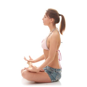 Full length portrait of a woman meditating on isolated white background