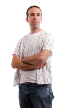 A young man dressed in casual clothing is standing with his arms crossed, isolated against a white background