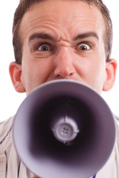 Closeup view of an angry man yelling at the viewer with a megaphone
