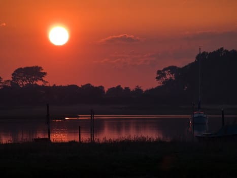 Boat in an amazing seascape of magical sunset - perfect nature boating background