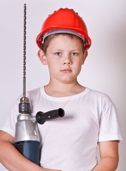 Portrait of a boy in a red protective helmet