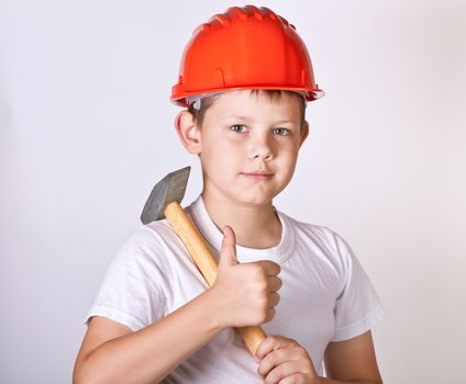 Portrait of a boy in a red protective helmet