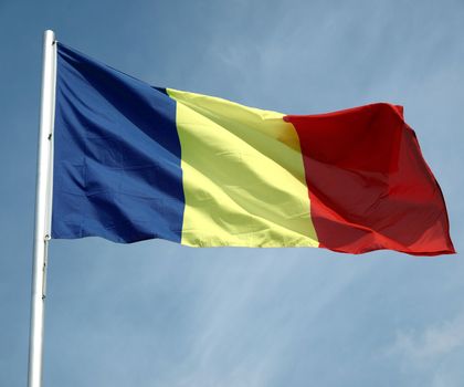 Flag of Romania over a blue sky