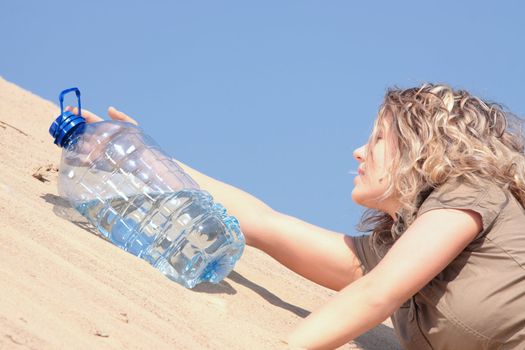 Thirsty girl looking for water on desert