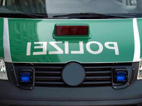 Typical German police car with reversed mirrored text "polizei"
