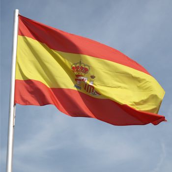 Flag of Spain over a blue sky