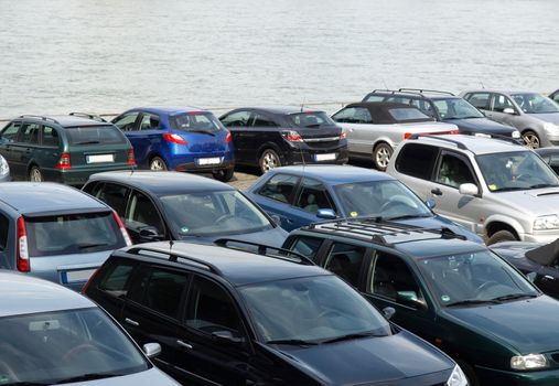 Car parking with many cars parked on the riverside