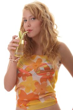 Young beautiful blond woman sipping cocktail (green ice tea) over white background