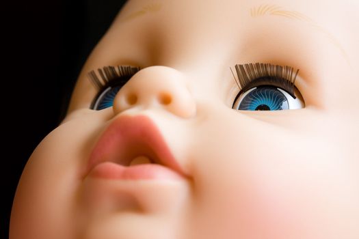 Close up of a doll with the focus on the left eye