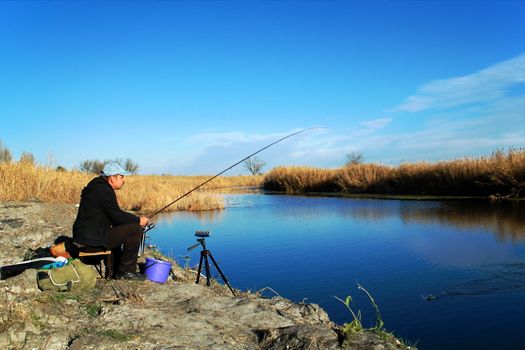 The fisherman is fishing on the river