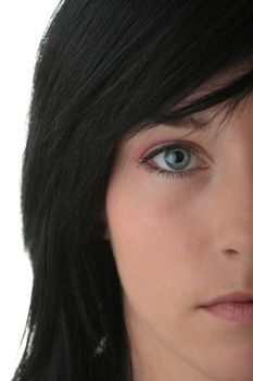 Half face of young woman with clean skin isolated on white background.