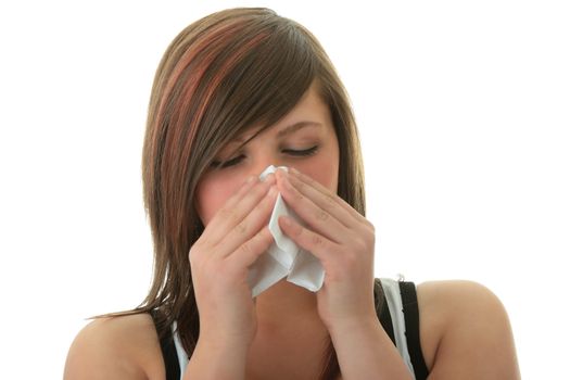 Young woman with allergy or cold holding handkerchief, isolated on white background