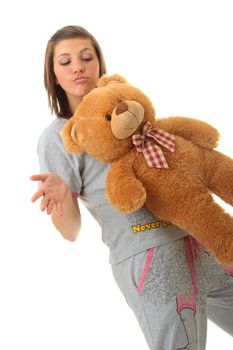 Beautiful teenager holding a teddy bear - isolated on white background