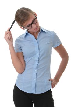 Portrait of a thoughtful young woman in blue shirt holding pen (secretary, student or young businesswoman)
