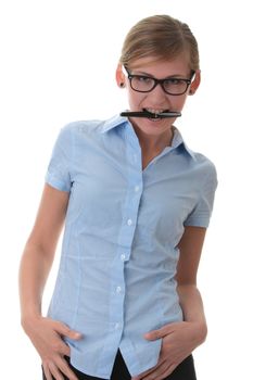 Portrait of a thoughtful young woman in blue shirt holding pen (secretary, student or young businesswoman)