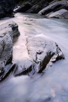 It is a beautiful river flow over the stone.