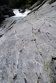 It is a beautiful river flow over the stone.