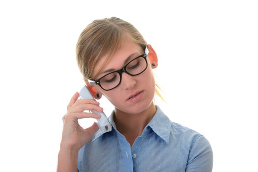 Portrait of a thoughtful young woman in blue shirt and glasses with phone