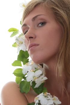 Beautiful blond woman with small white apple tree flowers isolated on white background