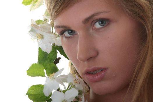 Beautiful blond woman with small white apple tree flowers isolated on white background