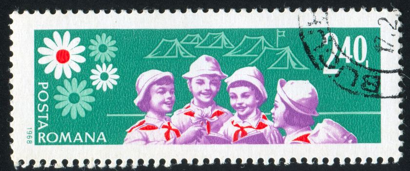 ROMANIA - CIRCA 1968: stamp printed by Romania, shows girl pioneer in camp, circa 1968