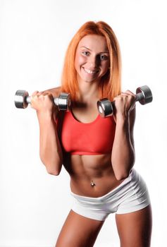 The young coach is engaged in bodybuilding dumbbell