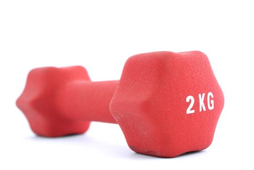 red 2 kg dumbbell isolated against white background