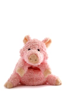 pink stuffed piglet isolated against white background