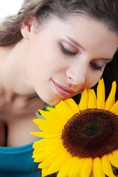 Portrait of a Beautiful girl with sunflower, studio shot over white