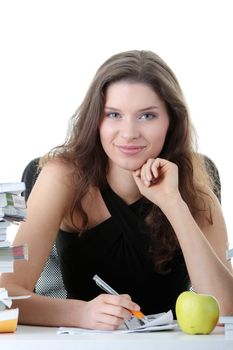 Portrait of young and pretty female student with books around isolated on white background