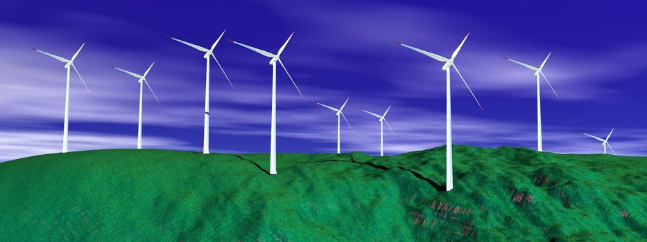 Wind turbines on a green hill with deep blue cloudy sky