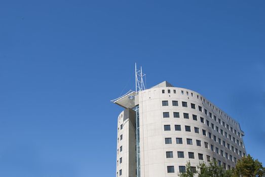 A White Office Block under a blue sky