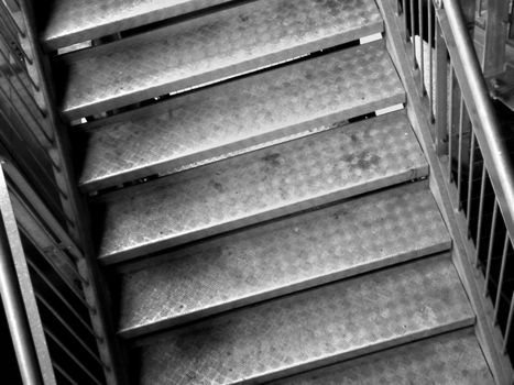 Photo presents part of stairs. Photo is black and white.