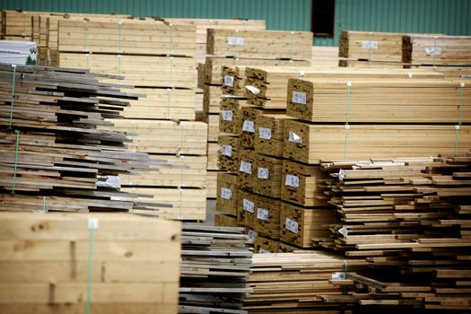 stacks of construction wood at a saw mill