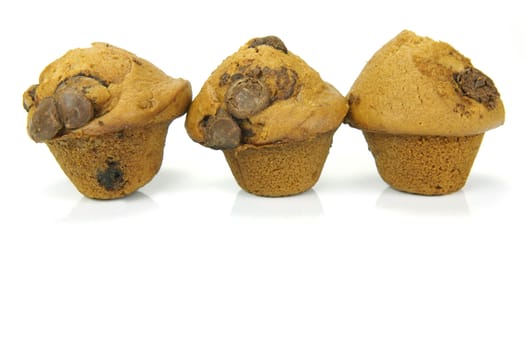 Choc chip mini muffins isolated against a white background