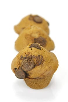 Choc chip mini muffins isolated against a white background