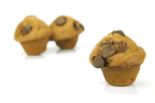 Choc chip mini muffins isolated against a white background