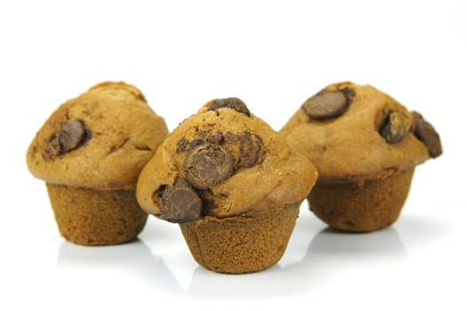 Choc chip mini muffins isolated against a white background