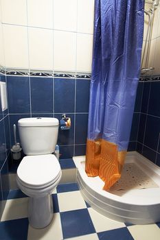 Toilet room and shower in modern hotel