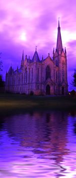 The Parish Church of Saint Laurence, with a gorgeous (and original), purple sky. 

(with water reflection)
