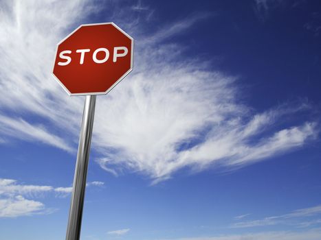 A red, traffic, STOP sign, made on a 3D rendering software.

(with a sky background)